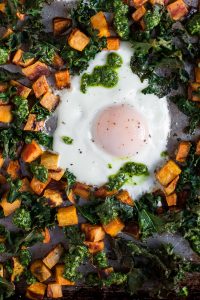 Sheet Pan Baked Eggs with Sweet Potatoes, Kale, & Cilantro-Pepita Pesto (Paleo, Whole30)